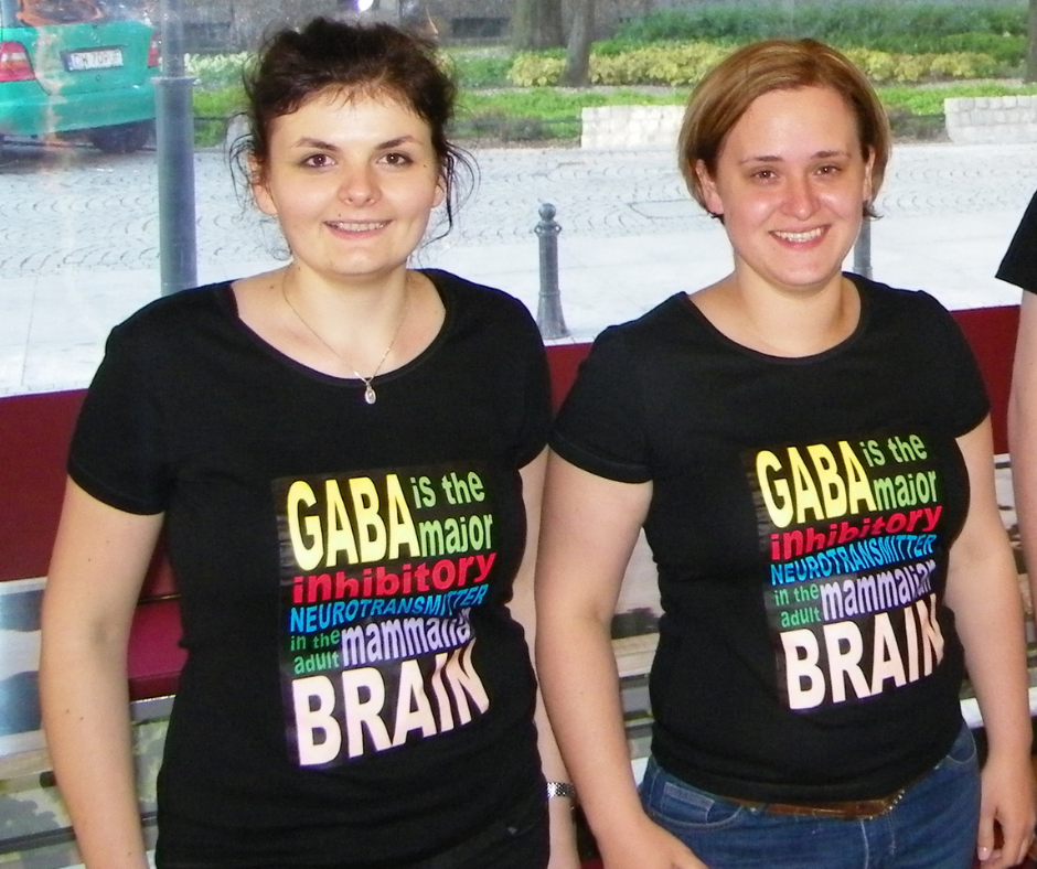 A woman standing in front of a palm tree
