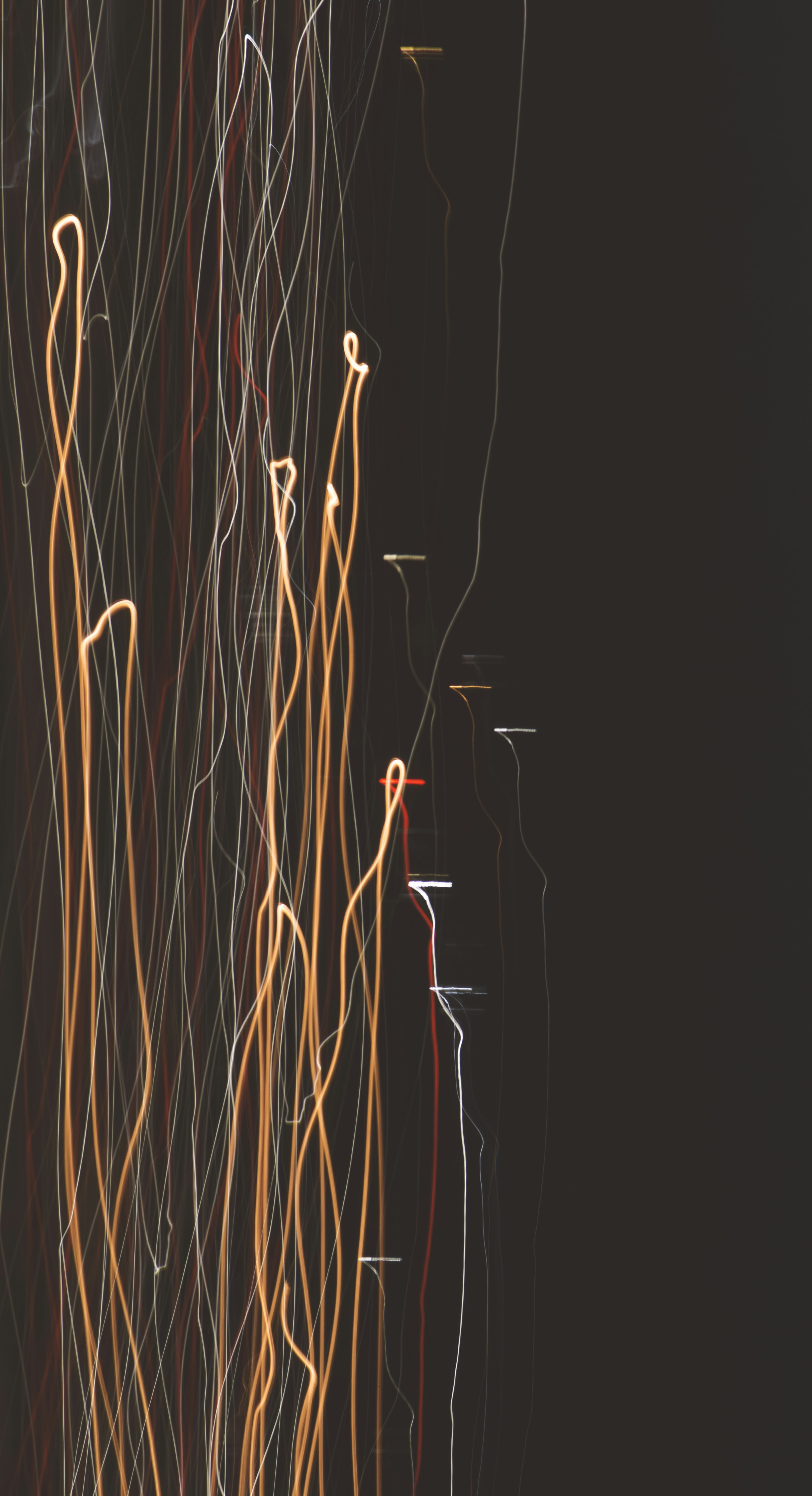 a black background with a bunch of orange and white lines