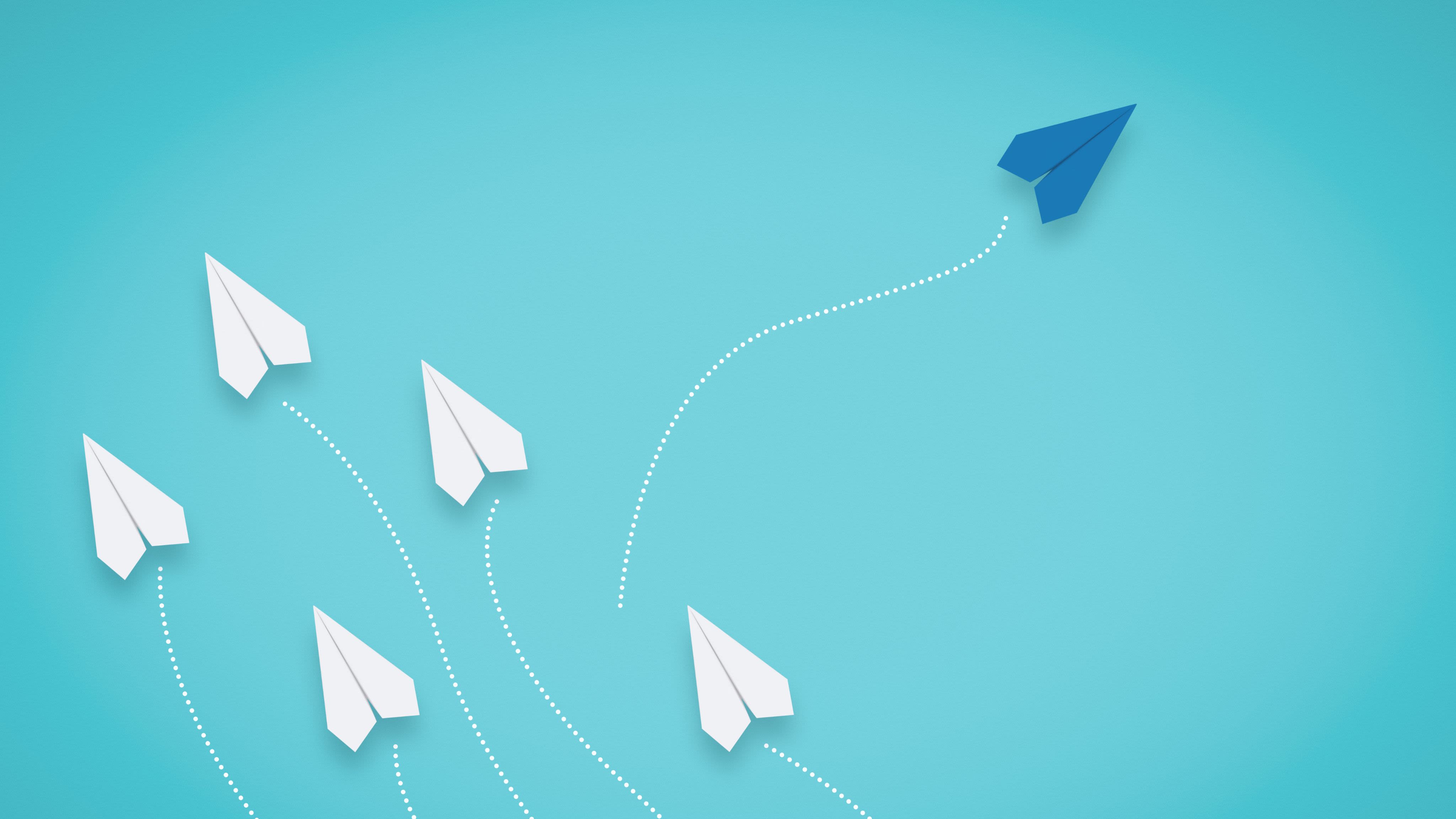 white arrow painted on brick wall