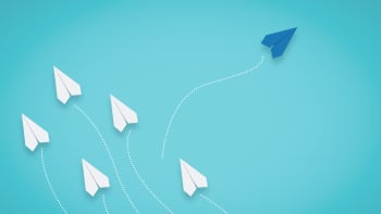 white arrow painted on brick wall